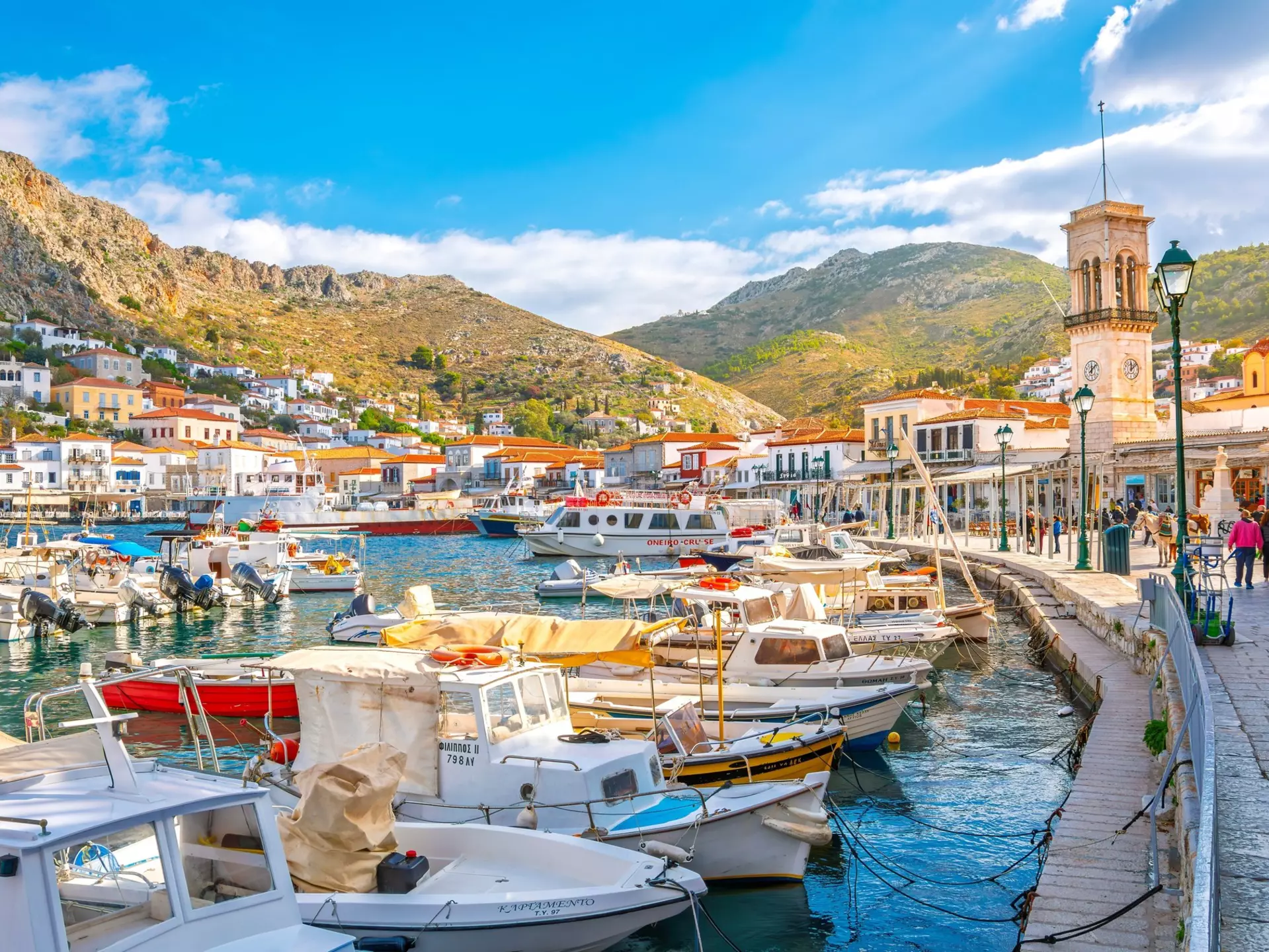 View of boats in the harbor and port of the Greek waterfront village of Hydra.