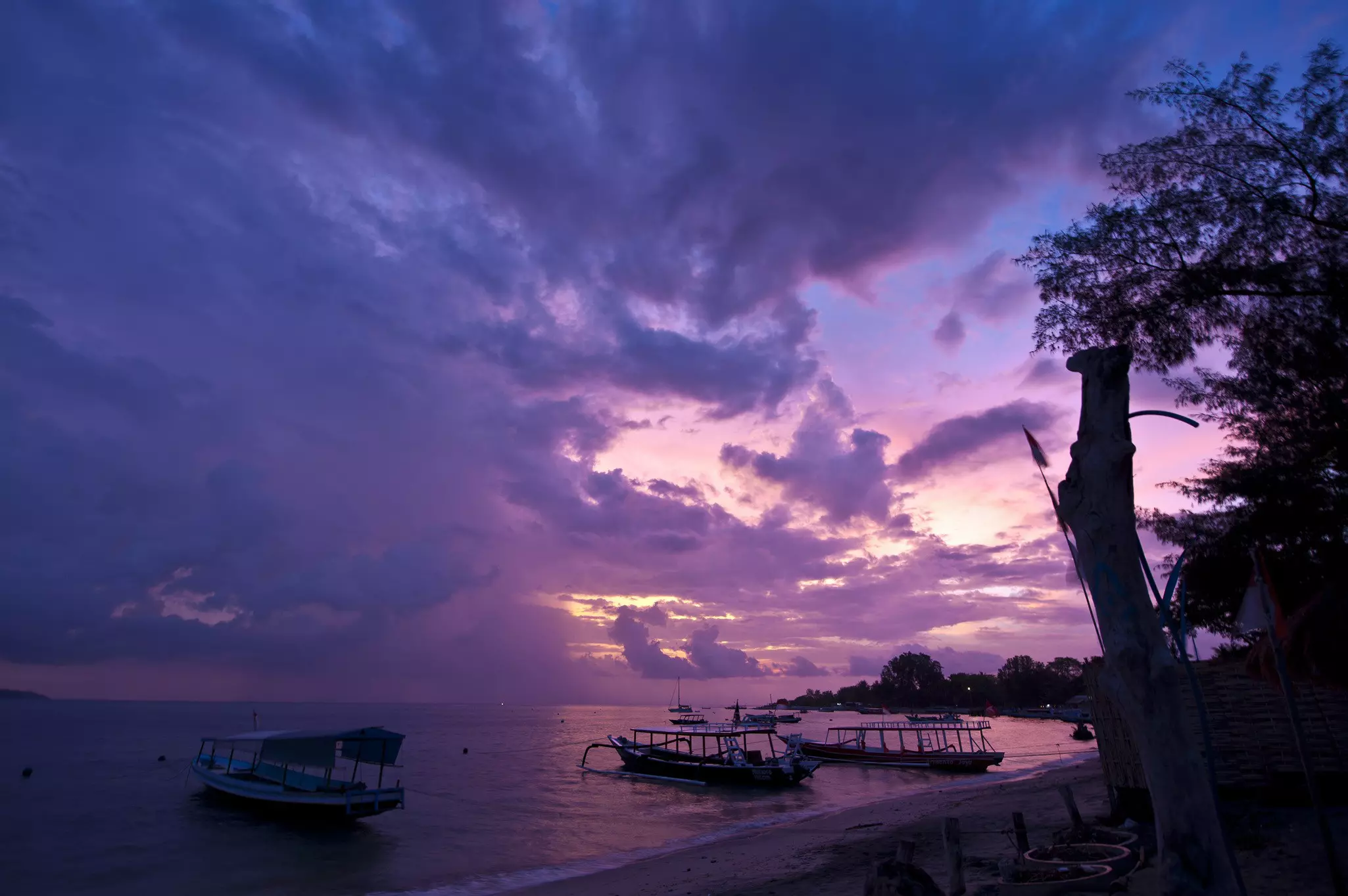 Silhouette of a beach in a purple-sky sunset