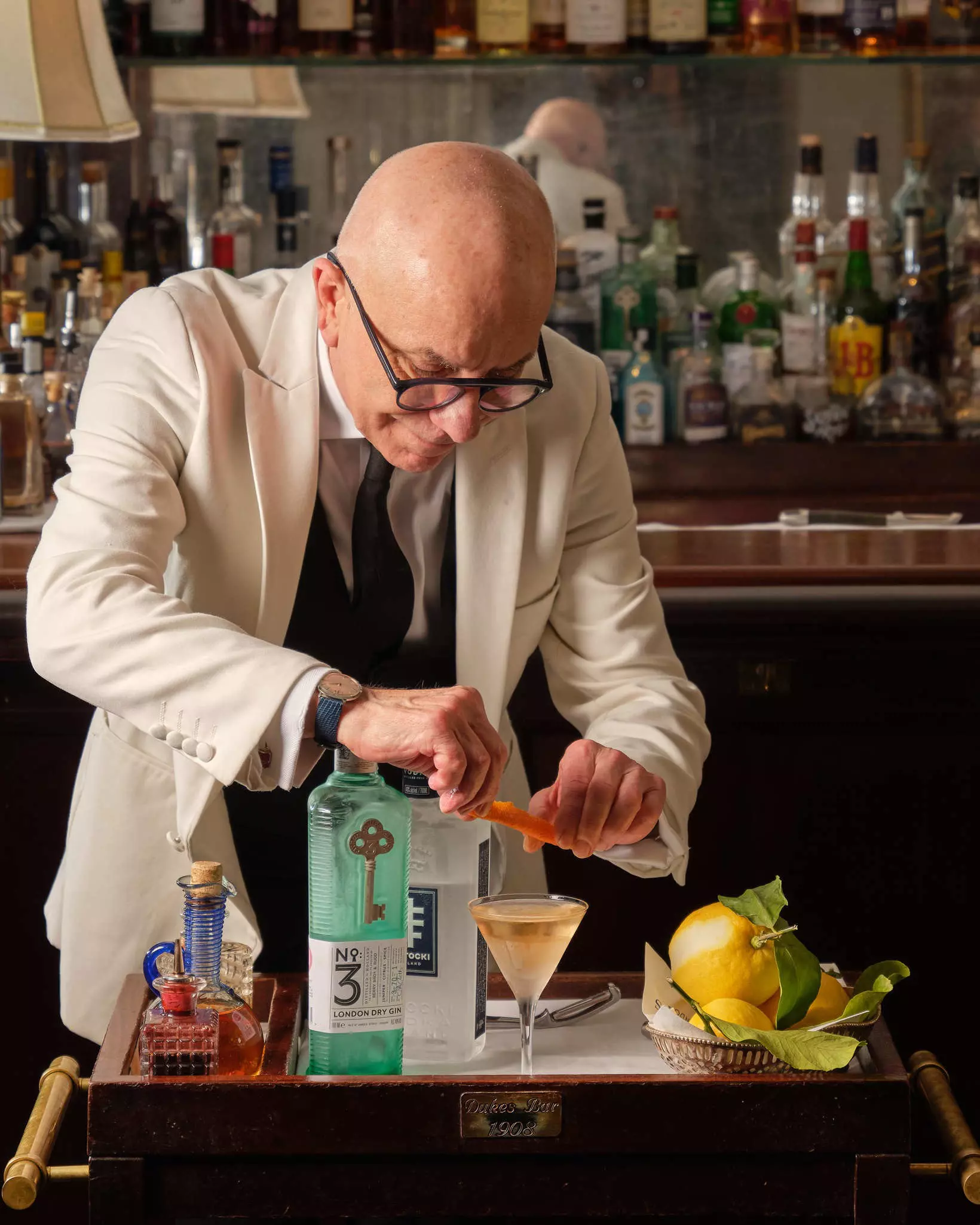 DUKES bartender Alessandro Palazzi  finishes making a cocktail at DUKES Bar in London