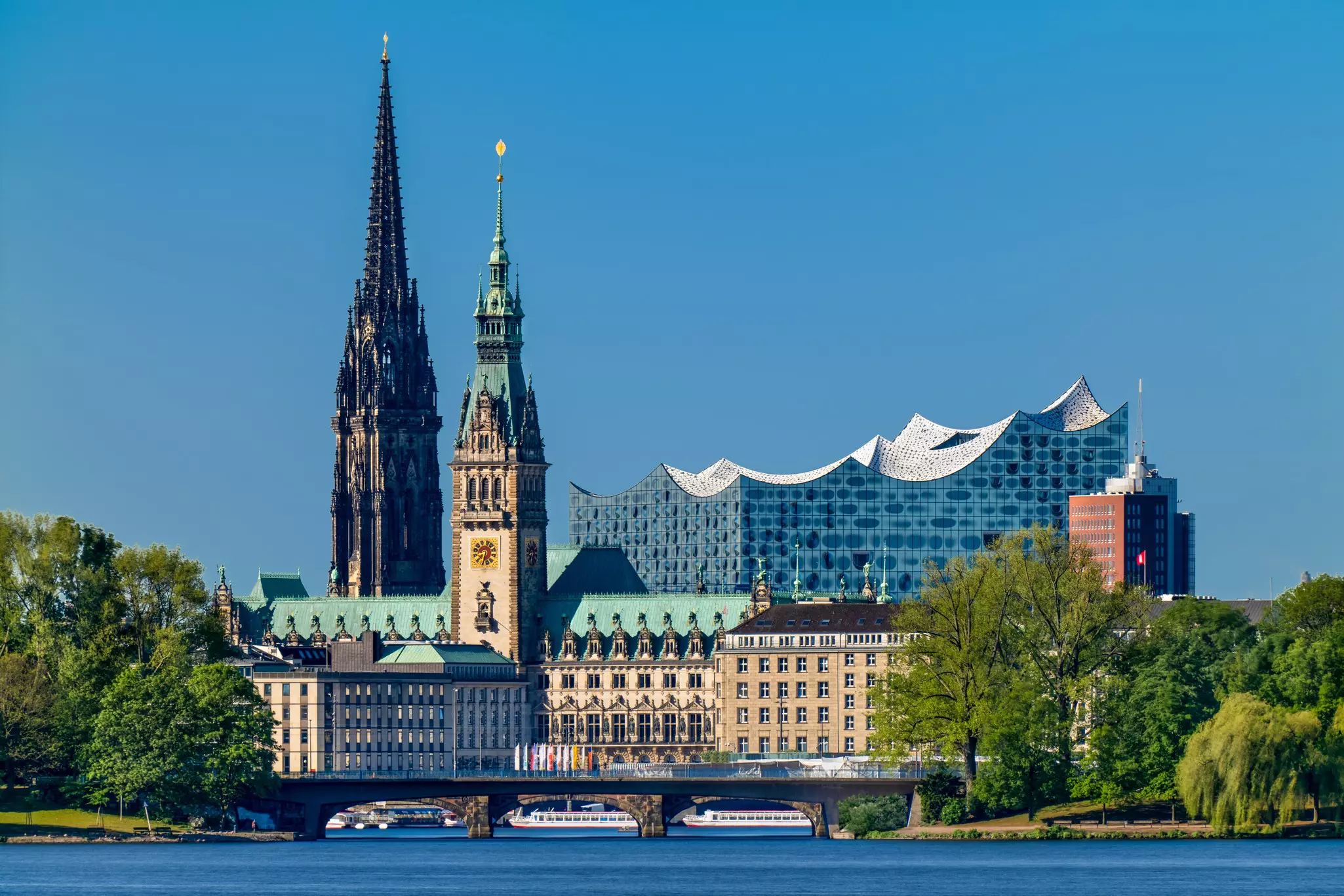Skyline of downtown Hamburg, with the Rathaus (City Hall) rising above the Alster lakes, Germany.