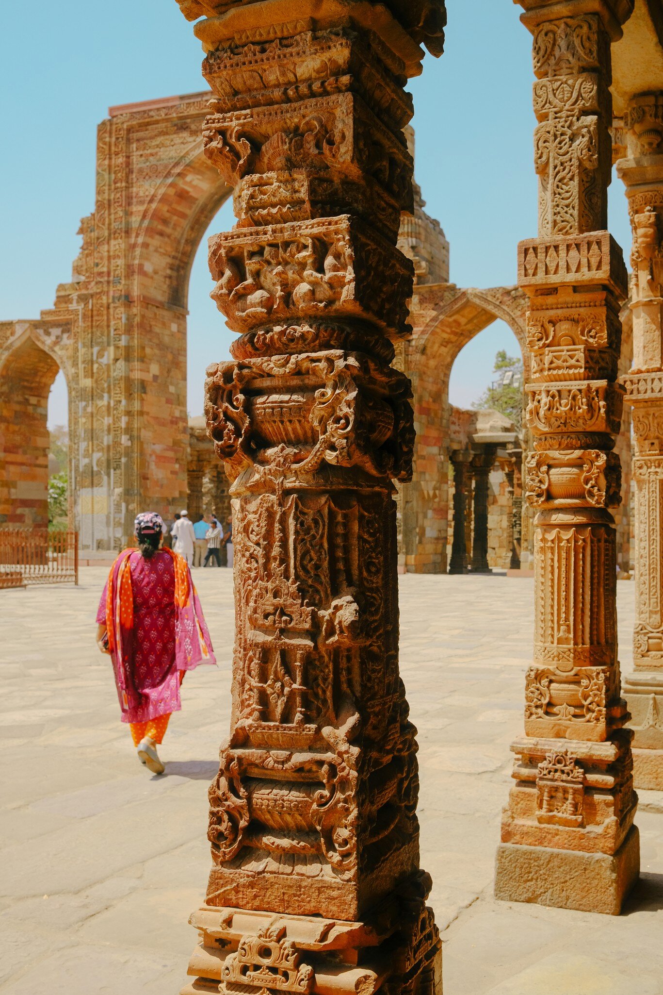 This is a photo of Qutub Minar, showing the intricate engraving and carvings done. The photo instills a sense of strength and poise.