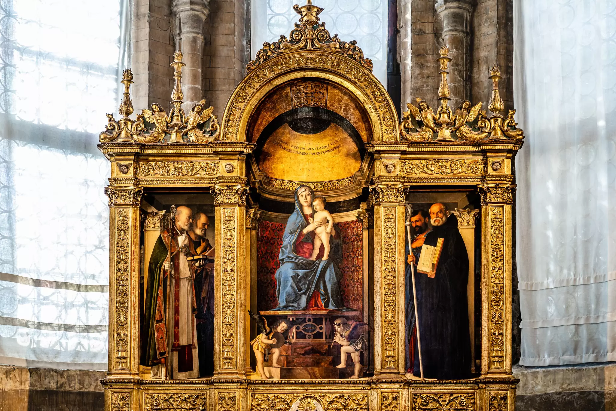 Giovanni Bellini’s triptych 'Madonna with Child' in the Sacristy of I Frari in Venice, Italy.