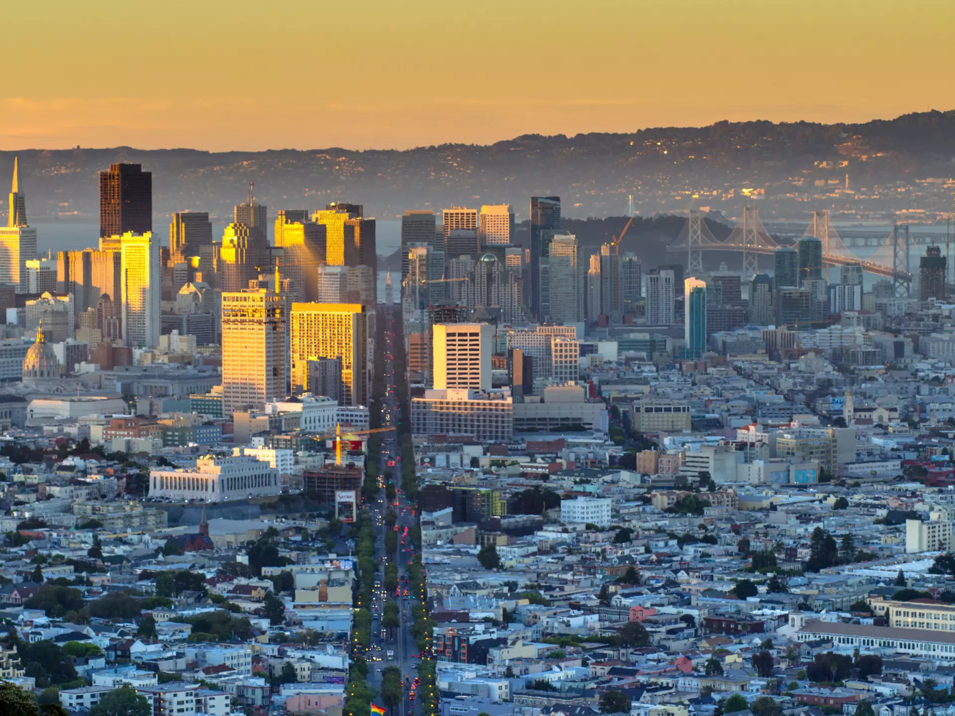 Aerial of Market Street in downtown San Francisco, as seen from Twin Peaks.
581043009
Urban Skyline, Busy, Twin Peaks - San Francisco, Downtown District, Sunrise - Dawn, Fog, Travel Destinations, Horizontal, Tourism, Building Exterior, San Francisco - California, San Francisco, San Francisco-Oakland Bay Bridge, Outdoors, High Angle View, Day, Market Street - San Francisco, Photography, Scenics - Nature, Color Image, Horizon Over Land, Hill, No People, Cityscape, Architecture, Famous Place, International Landmark, USA, California, Skyline, Sunlight