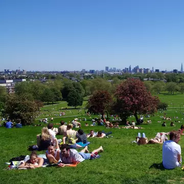 People lay on the grass at Primrose Hill in Regent's Park, with the skyline of central London on the horizon.
569077953
Primrose Hill, Grass, Capital Cities, Sitting, Human Interest, London, Friendship, UK, Sunlight, Day, London - England, Sky, View, Blue, Horizontal, Photography, Sunbathing, Outdoors, People, Tree, Built Structure, Blossom, Color Image, Summer, Urban Skyline, Lawn, Relaxation, England