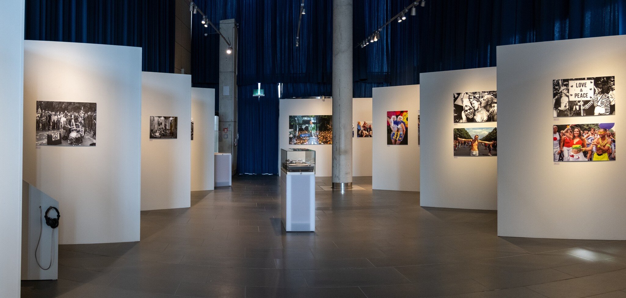 Wide interior view of a photo exhibition gallery at the House of the History of the Federal Republic of Germany in Bonn, Germany. 