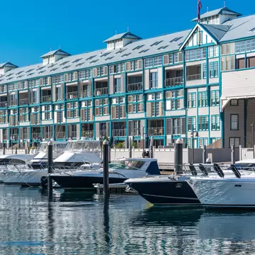 Historic landmark Woolloomooloo wharf with yachts and boats on sunny day. Sydney, Australia.