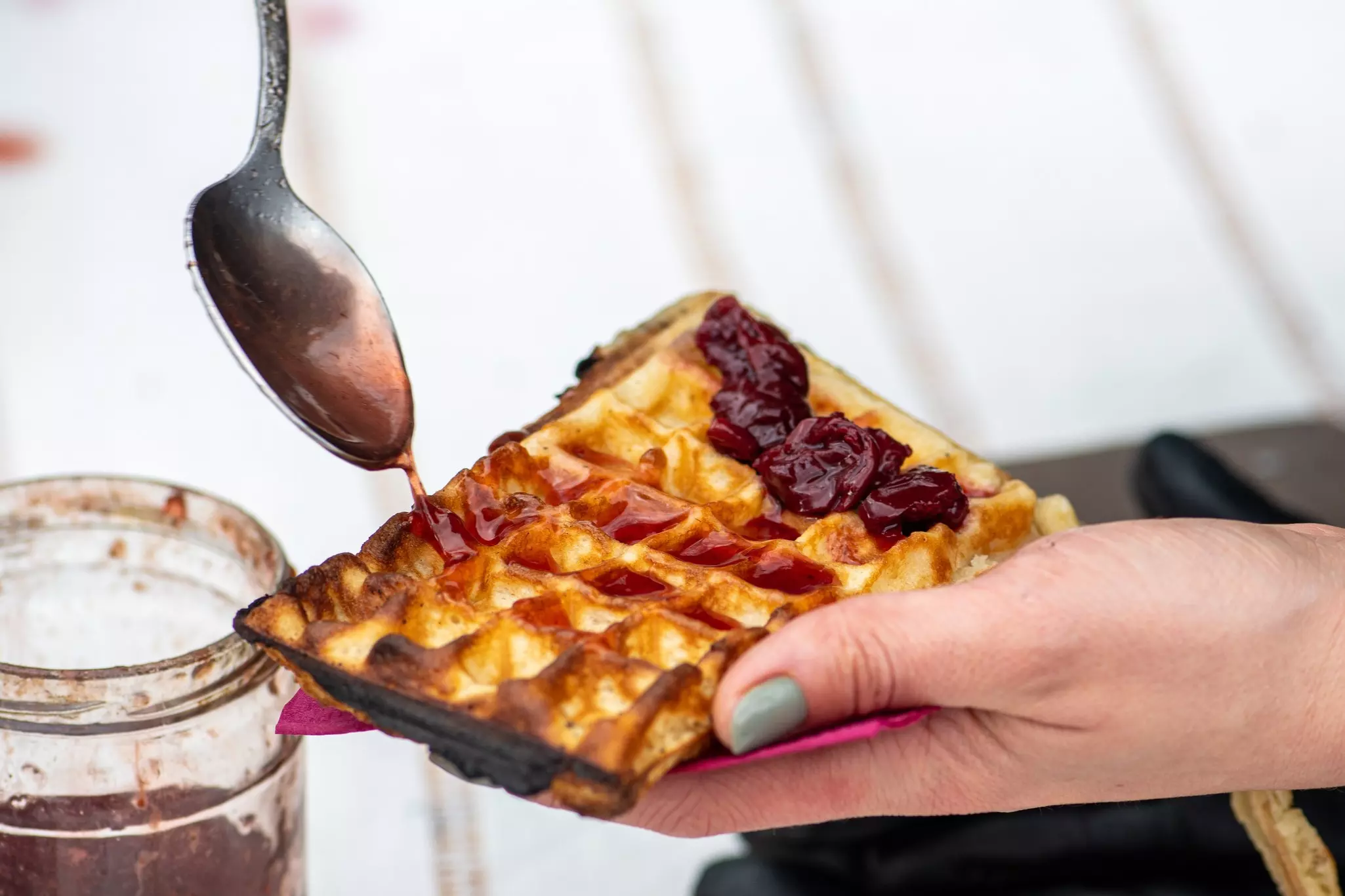 Preparing waffle or waffles with jam, dish made from leavened batter or dough that is cooked between two plates that are patterned to give a characteristic size, shape, and surface impression