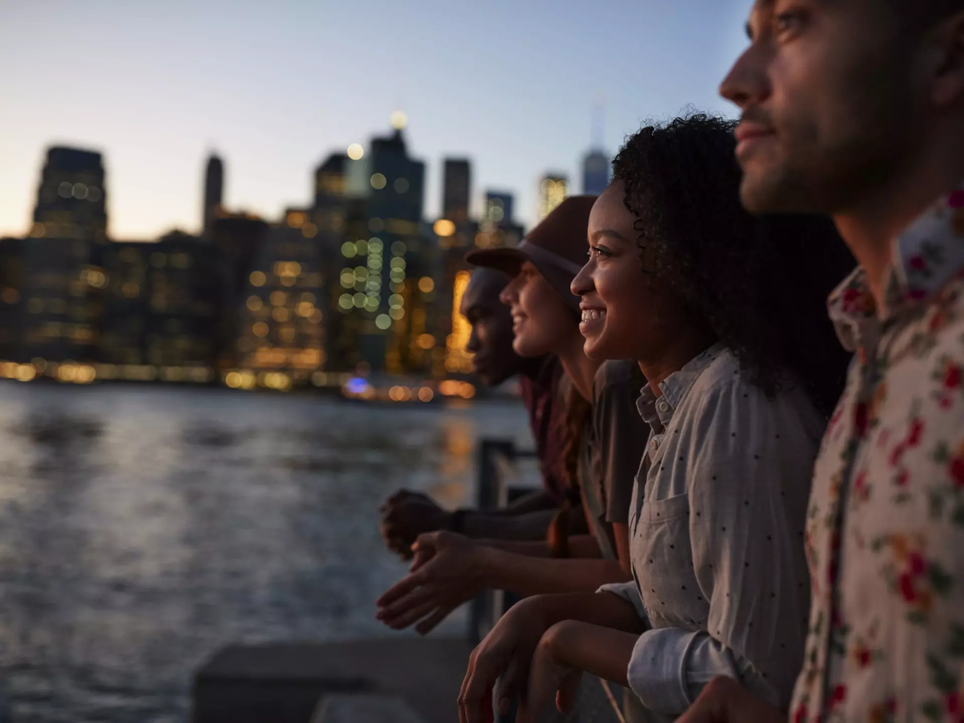 Four people sitting by the river at dusk with the Manhattan skyline beyond.
Group Of Young Friends On Trip To Manhattan At Dusk
901596148
20-29 Years; 20s; Adult; Adults Only; African-American Ethnicity; America; Black; Cheerful; City; Couple - Relationship; Dusk; Excitement; Female; Flare; Four People; Friendship; Group; Group Of People; Heterosexual Couple; Holiday; Horizontal; Latin; Leisure Activity; Male; Manhattan; Manhattan - New York City; Men; Multi-Ethnic; New York City; Night; NY; Outdoors; People; Photography; Side View; Skyline; Smiling; Sunset; Togetherness; Tourism; Tourist; Travel Destinations; Trinidadian Ethnicity; Urban Skyline; USA; Vacation; Vacations; Waist Up; Women; Young Adult; Young Couple; Young Men; Young Women;