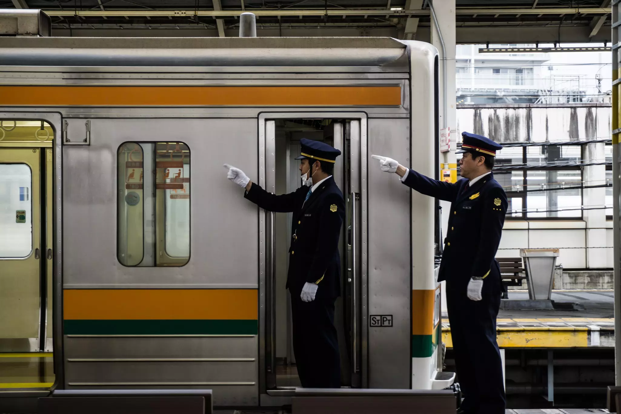 Japanese train drivers conduct safety checks before departure, Japan.