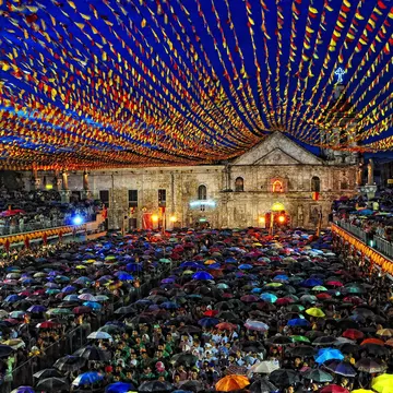 Pilgrims in town square at night for the coming Fiesta of Sr. Sto. Niño, at Basilica Minore Del Sto, Nino De Cebu, Cebu City.