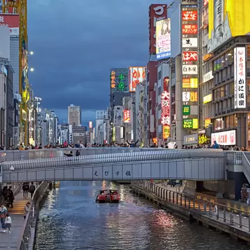 Osaka, Japan, April 2018. People crossing the Ebisu bridge on the Dontonbori canal at sunset., License Type: media, Download Time: 2026-05-28T21:03:25.000Z, User: LP_NZhan, Editorial: true, purchase_order: 65050 - Digital Destinations and Articles, job: App Content, client: Lonely Planet, other: Nadine Zhan