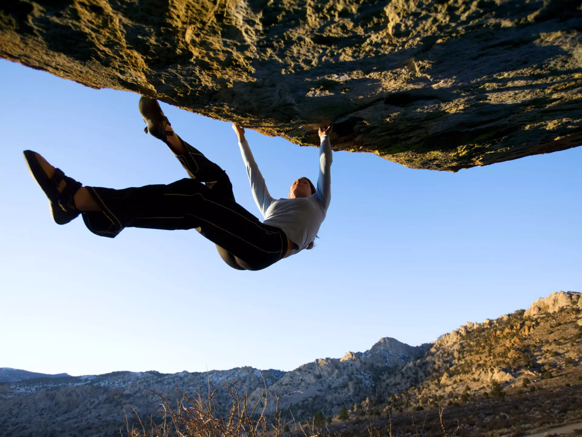 People Activity Vitality Agility Strength Adventure Danger Getting Away From It All Balance Determination Effort Challenge Skill Lifestyles Horizontal Outdoors Back Lit Low Angle View Moving Up USA Blue Sky Mountain Mountain Range Rock - Object Boulder - Rock Day Solitude California One Person Rock Climbing Adult Color Image Rock Overhang Gripping Remote Athlete One Woman Only Leisure Activity Photography Non-Urban Scene Unrecognizable Person Bouldering Climbing Adults Only Owens River Gorge Bishop - California Buttermilk Boulders
Woman bouldering on an overhang at the Buttermilk Boulders near Bishop California..