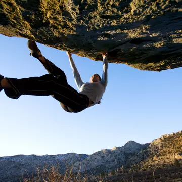 People Activity Vitality Agility Strength Adventure Danger Getting Away From It All Balance Determination Effort Challenge Skill Lifestyles Horizontal Outdoors Back Lit Low Angle View Moving Up USA Blue Sky Mountain Mountain Range Rock - Object Boulder - Rock Day Solitude California One Person Rock Climbing Adult Color Image Rock Overhang Gripping Remote Athlete One Woman Only Leisure Activity Photography Non-Urban Scene Unrecognizable Person Bouldering Climbing Adults Only Owens River Gorge Bishop - California Buttermilk Boulders
Woman bouldering on an overhang at the Buttermilk Boulders near Bishop California..