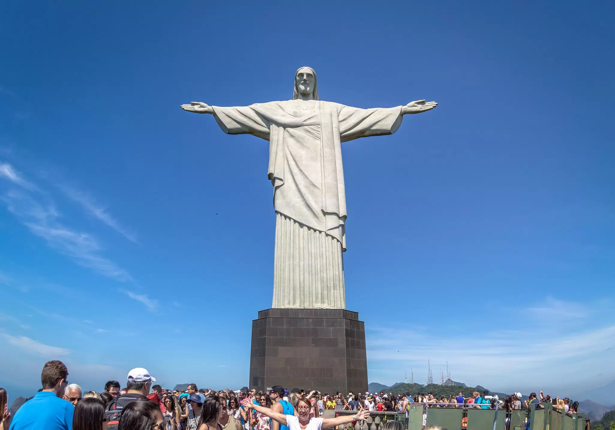 Low-angle view of the Cristo Redentor statue on a sunny day in Rio de Janeiro, Brazil.