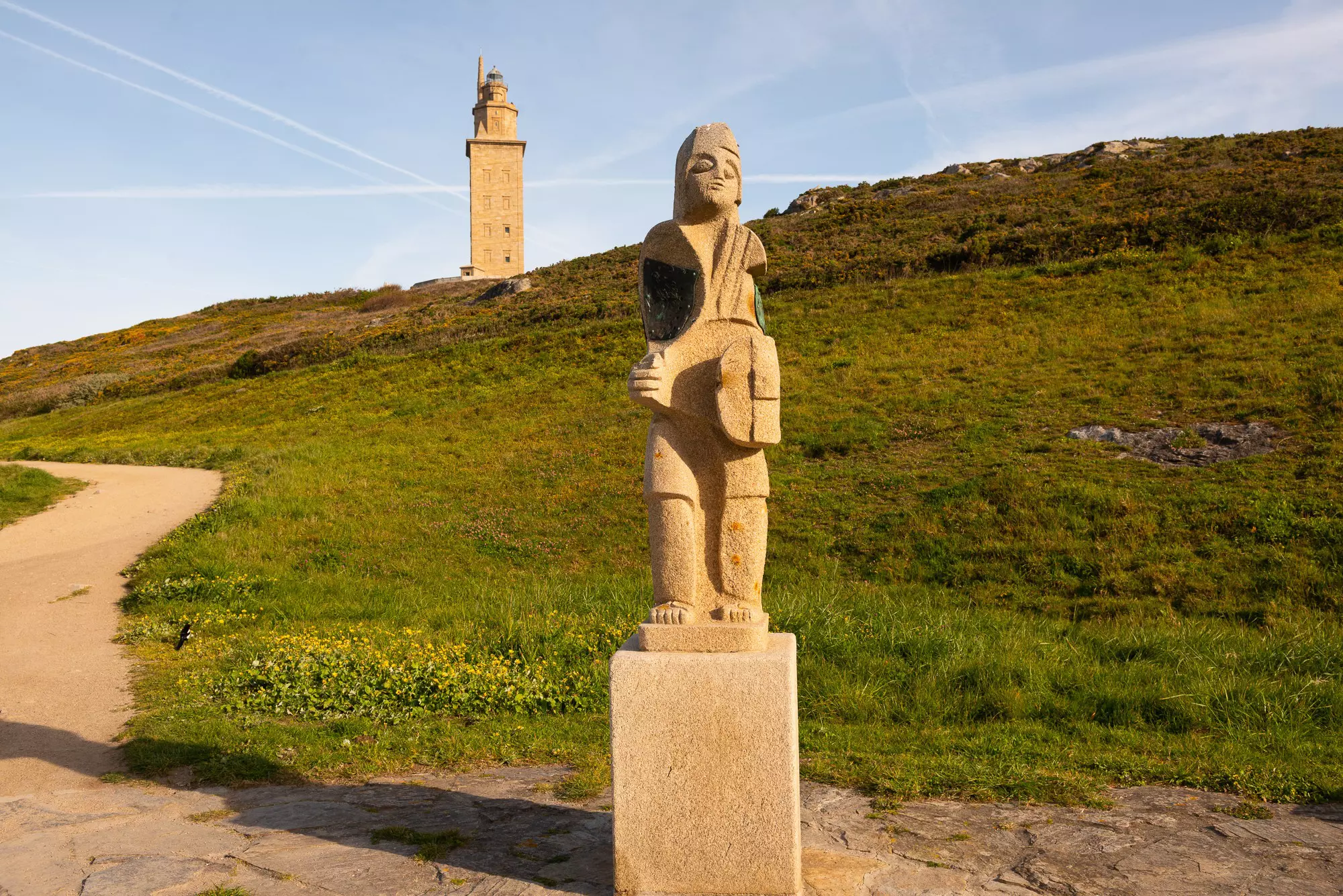 Statue of Breogan and Tower of Hercules during the 'golden hour' © Austin Bush
