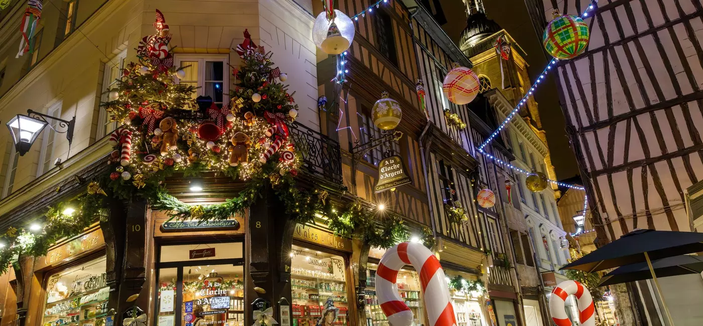 Colorful storefront of delicatessen shops decorated for Christmas