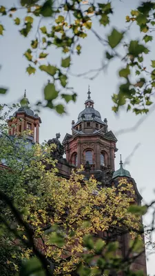 Kelvingrove Gallery Towers Framed by Leaves, License Type: media, Download Time: 2025-08-06T19:35:26.000Z, User: katelyn.perry_lonelyplanet, Editorial: false, purchase_order: 65050 - Digital Destinations and Articles, job: wip, client: wip, other: Katelyn Perry