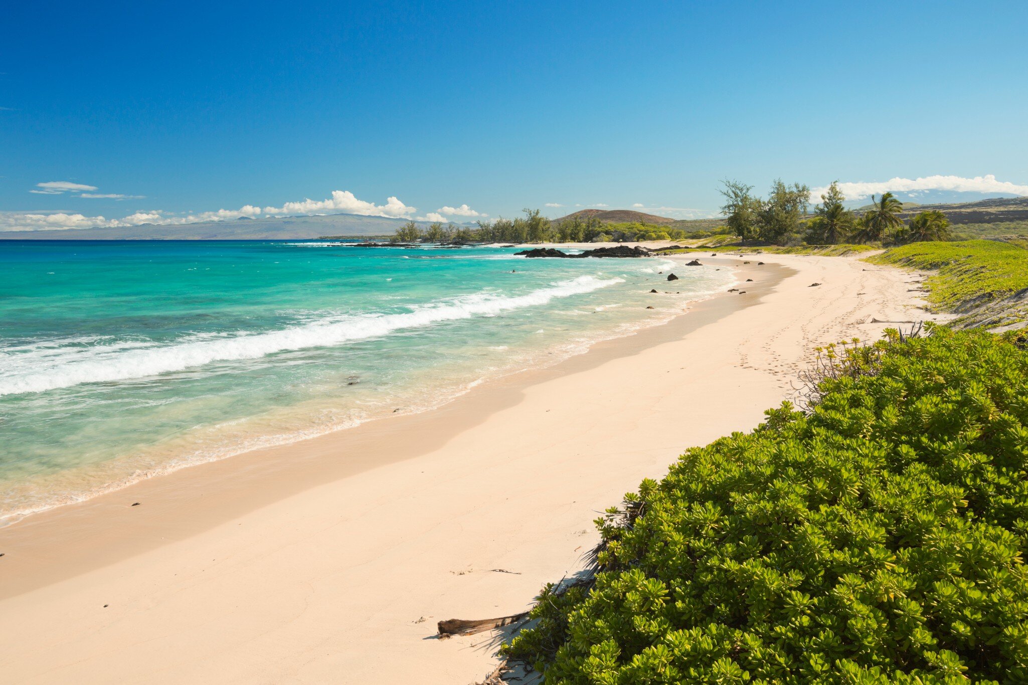 Makalawena Beach on Big Island Hawaii, USA, a beautiful remote white sand beach and turquoise water.; Shutterstock ID 1583199166; your: Sloane Tucker; gl: 65050; netsuite: Online Editorial; full: POI