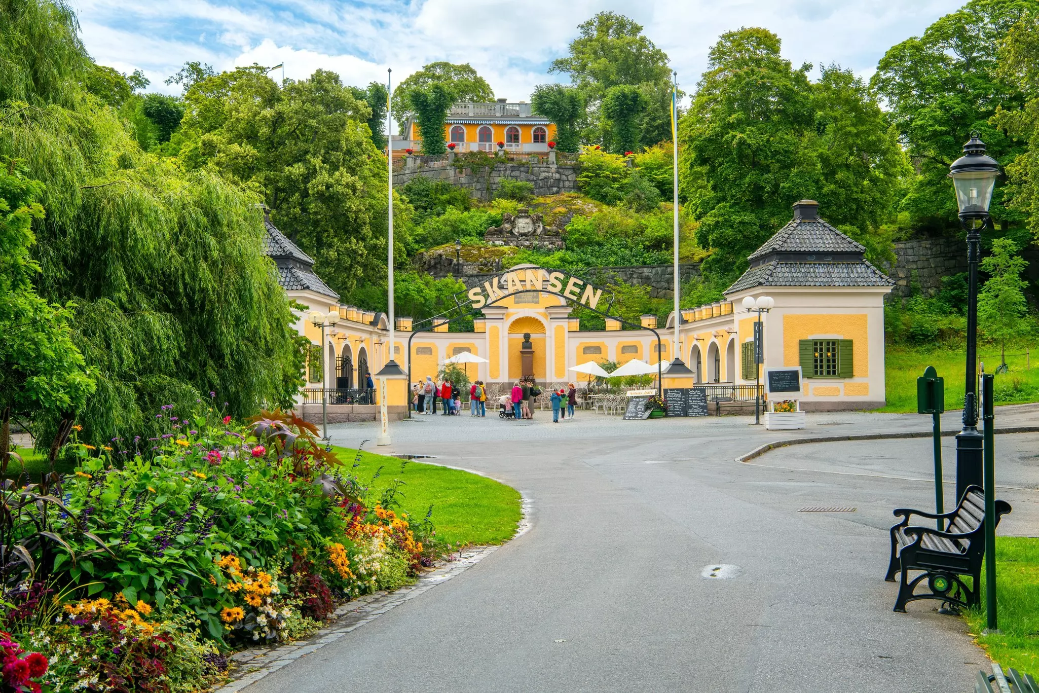 The welcoming entrance to an open-air museum set in lush landcaped gardens: Skansen on the island of Djurgården, Stockholm. 