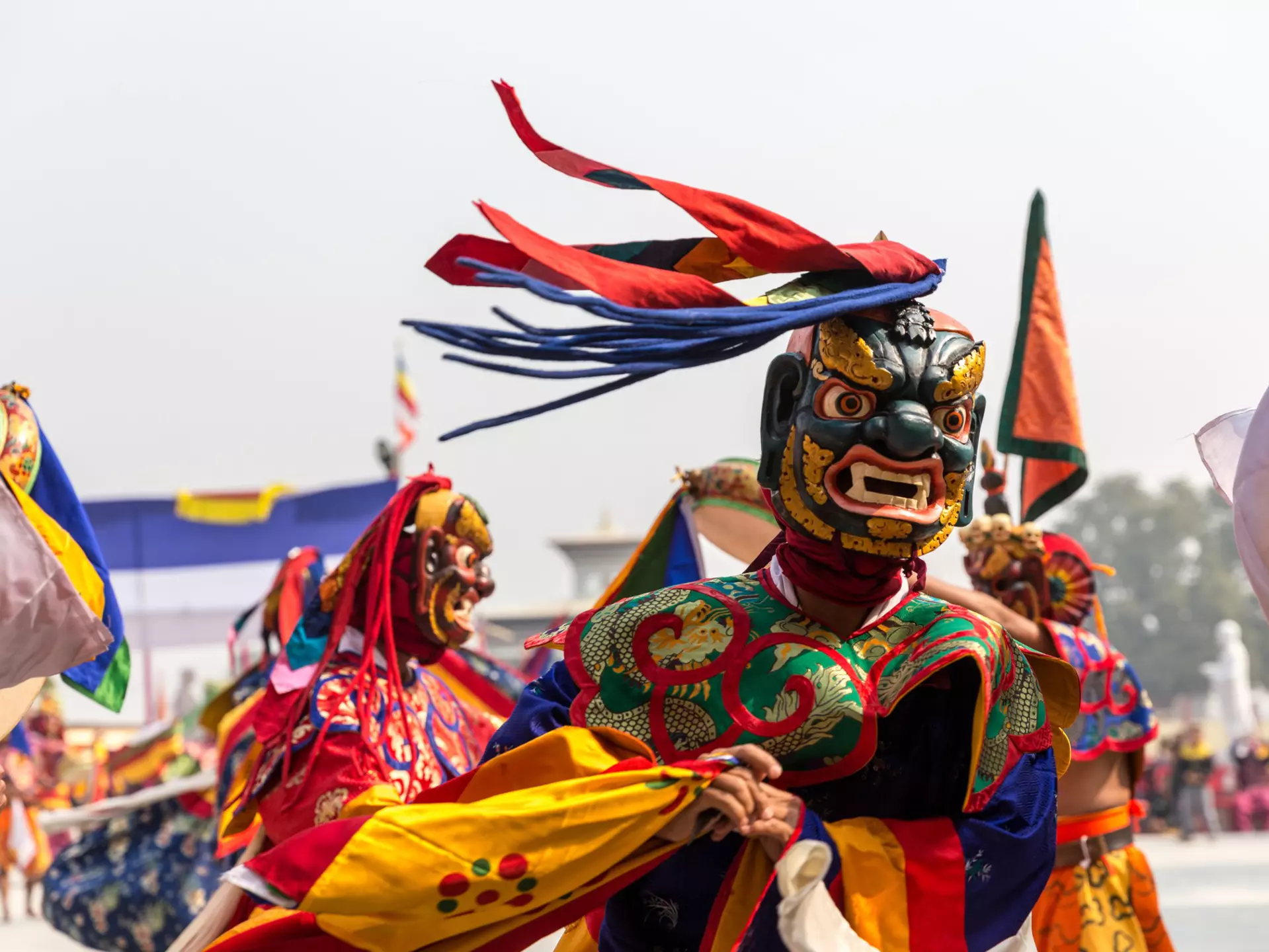 A Buddhist monk practices a traditional mask dance. ryosho/Shutterstock 