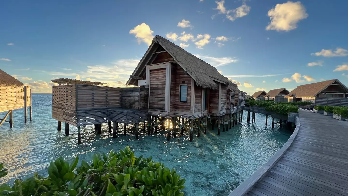 Overwater villas on along a wooden walkway