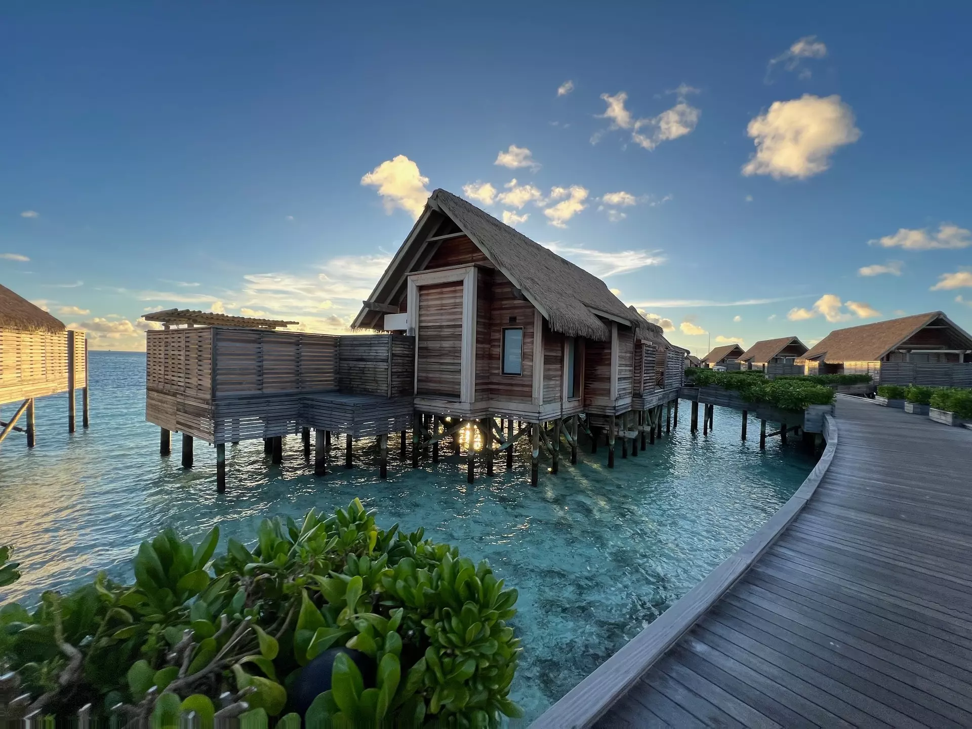 Overwater villas on along a wooden walkway