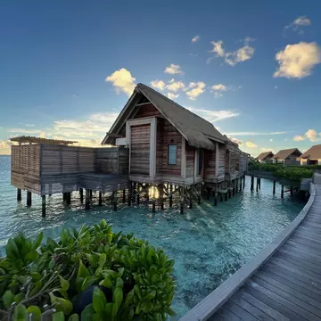 Overwater villas on along a wooden walkway