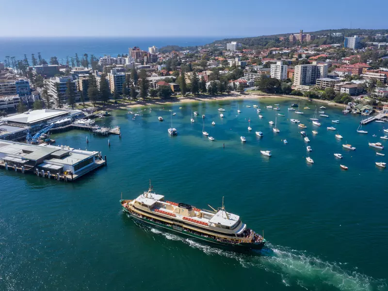 Aerial view of the Circular Quay ferry approaching Manly Wharf and harbour in Sydney, Australia