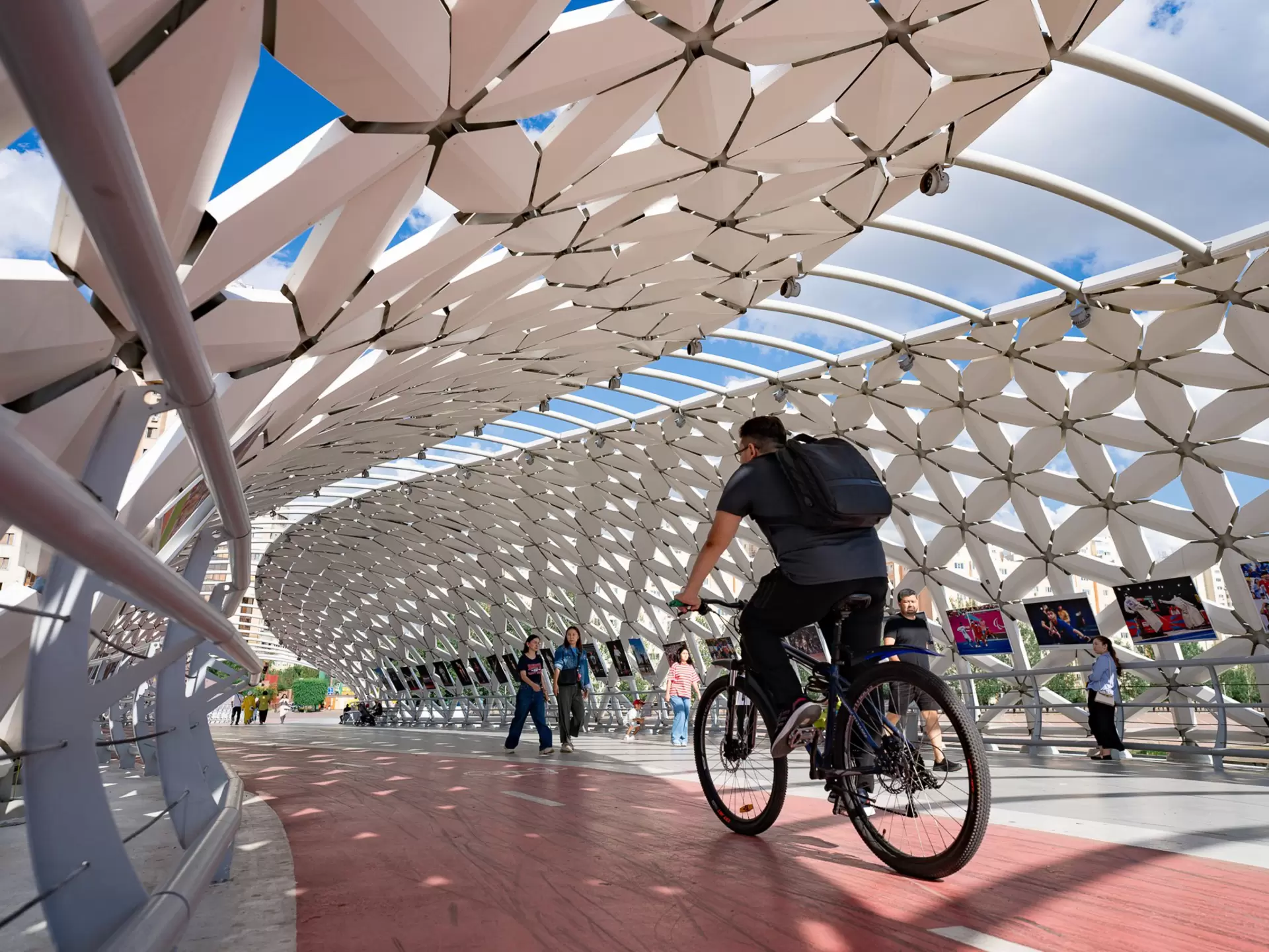 A cyclist on the futuristic Atyrau Bridge in Astana, Kazakhstan. 