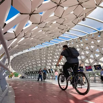 A cyclist on the futuristic Atyrau Bridge in Astana, Kazakhstan. 