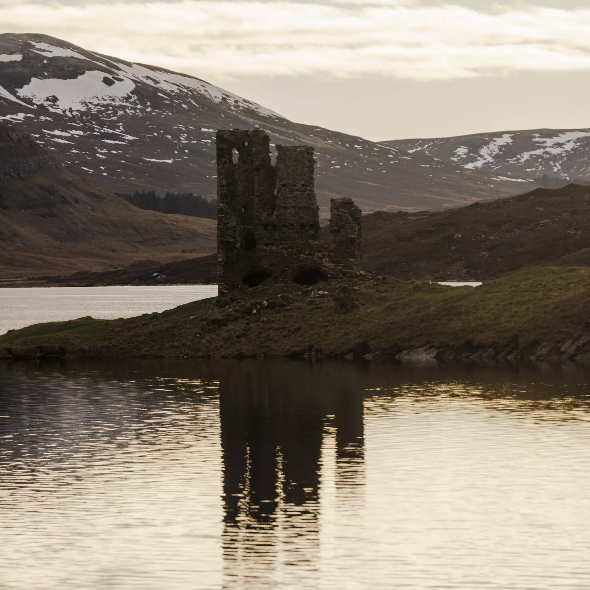 A view of Ardvreck Castle on Loch Assynt in Scotland.