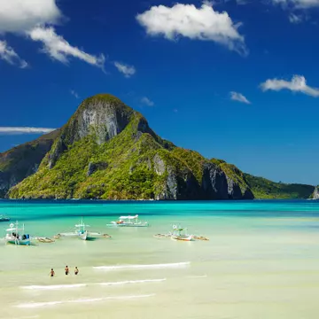 View of green mountain and tropical beach, El Nido bay, Palawan island, Philippines
