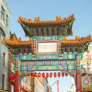 View of the Chinatown Gate and Chinese New Year's decorations in Chinatown in London, UK.