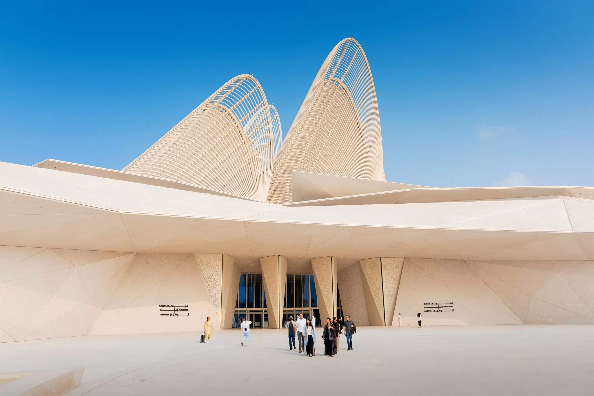 The striking architecture of the Zayed National Museum, Abu Dhabi, with wing-like forms rising over the entrance, UAE.