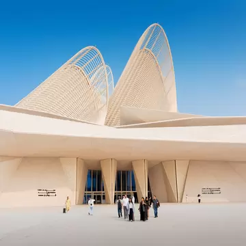 6 December 2025, Abu Dhabi, UAE: Zayed National Museum exterior with iconic falcon wing towers and visitors walking on Saadiyat Island, License Type: media, Download Time: 2026-05-27T21:30:46.000Z, User: lonelyplanetmedia, Editorial: true, purchase_order: 65050 - Digital Destinations and Articles, job: Comp Ingestion, client: Global Publishing WIP, other: Pia Peterson