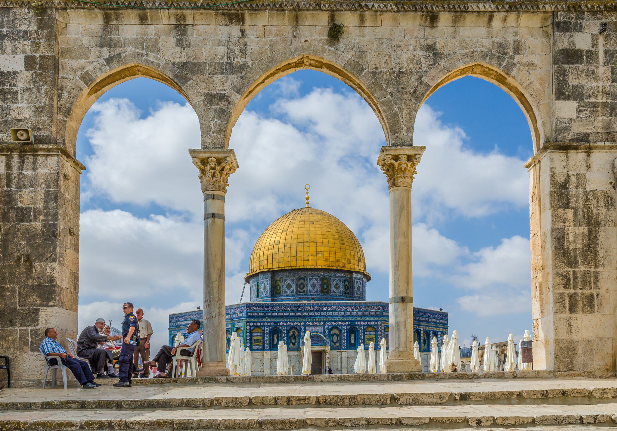 JERUSALEM, ISRAEL JUNE 10 2015: Israeli Temple Mount policeman greets the locals under the arches near the Dome of the Rock on the Temple Mount on June 10 2015 in the Old City of Jerusalem Israel.
408810679
palestine, islam, arch, octagonal, historical, rotunda, caliph, travel, rock, mosque, marble, landmark, middle, history, mount, east, old, dome, israel, religious, historic, architecture, gold, city, sacred, temple, mosaic, panorama, hexagon, omar, holy, tourism, islamic, religion, jerusalem, golden, ancient, arab, land, muslim, shrine, moriah, al-malik, abd, umayyad, qubbat, as-sakhrah