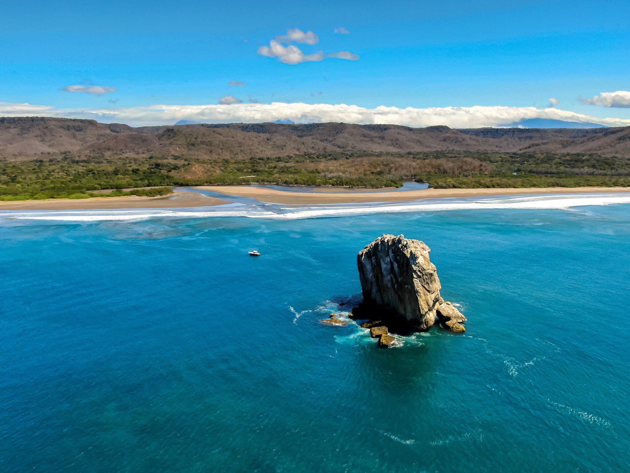 Beautiful aerial view of a sunset in Naranjo Beach - Witch Rock, Costa Rica.