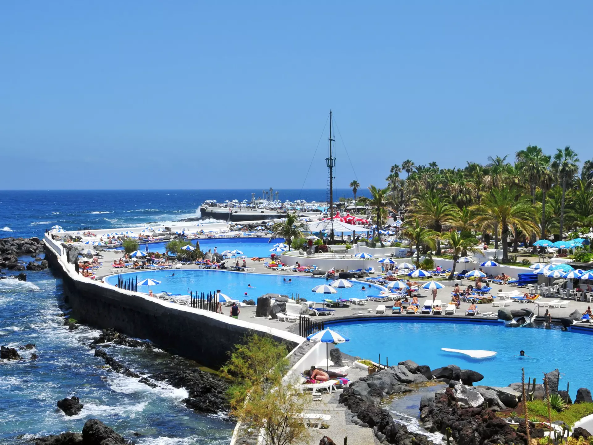 June 16, 201: Lago Martianez in Puerto de la Cruz.
80868469
amusement, canary, cesar, coast, colorful, complex, cruz, destination, europe, european, geology, heat, horizontal, hot, islands, lago, landmark, landscape, manrique, martianez, ocean, picturesque, pool, public, puerto, relax, resort, rock, rocky, scene, scenic, sea, seashore, seawater, shape, shore, spain, summer, swimming, tan, tenerife, tourism, tourist, town, travel, umbrella, vacations, view, village, volcanic