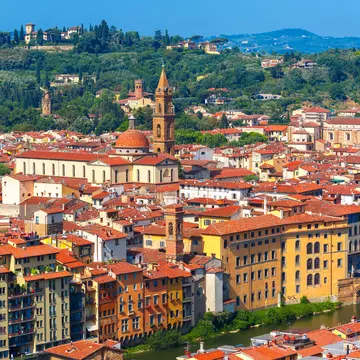 View of the Arno River, Giardino Torrigiani and more from Palazzo Vecchio in Florence. kavalenkava/Shutterstock