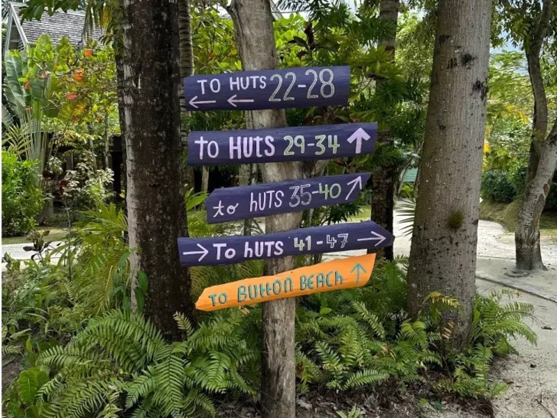 Signposts point the way to huts at a resort