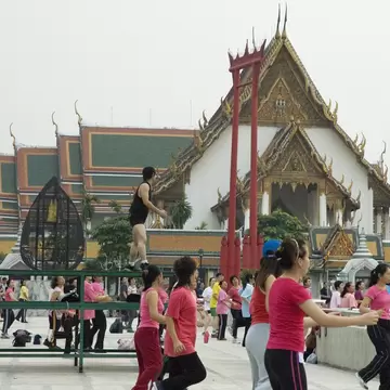 23281-51
Asia, Bangkok, South-East Asia, Thailand, activity, adult, architecture, asian, building, colourful, compatible, concrete, contrast, culture, day, energy, exterior, facade, female, fitness, group of people, health, large group of people, leadership, lifestyle, male, mixed age range, mixed gender, order, outdoors, people, public space, repetition, side view, sky, south east asian, sport & recreation, square, structure, temple, unity, unusual, urban
People exercising in front of Sao Ching-Cha (Giant Swing), with Wat Suthat in background.