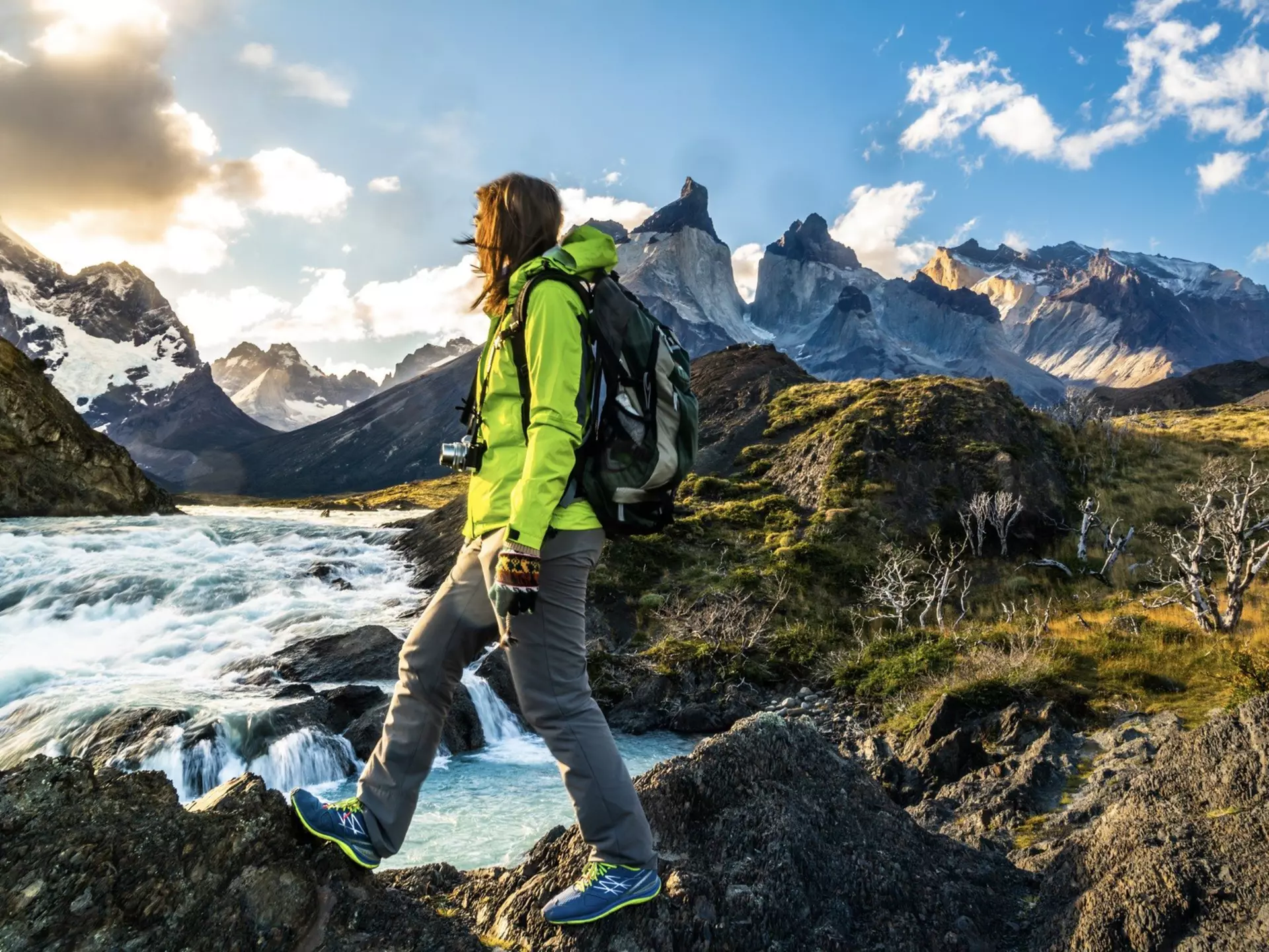 Female hiker walking on rocky ground near Salto Grande Waterfall
