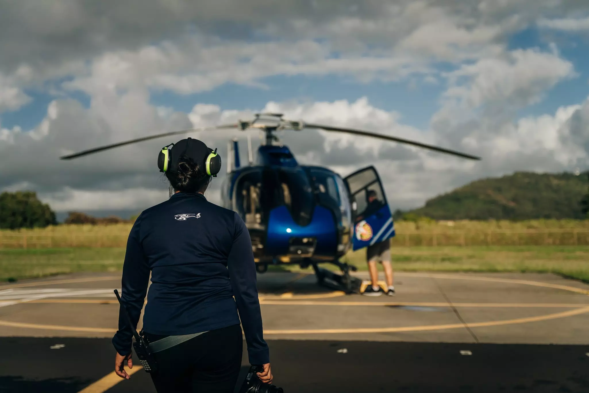People getting ready to board a Blue Hawaiian helicopter on Kauaʻi.