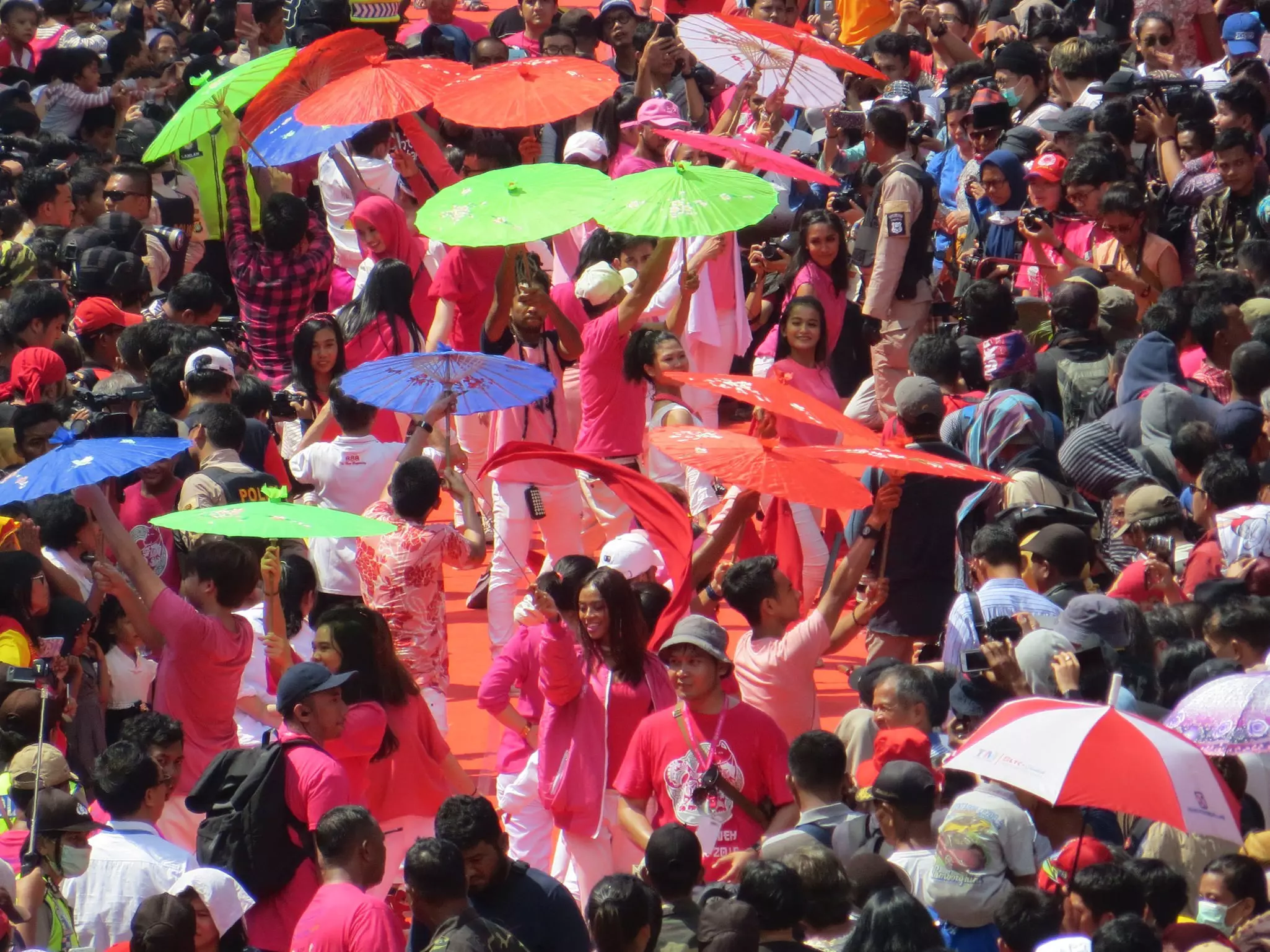 People in colorful clothing in the Chinese-dominated neighborhood of Glodok in Jakarta.