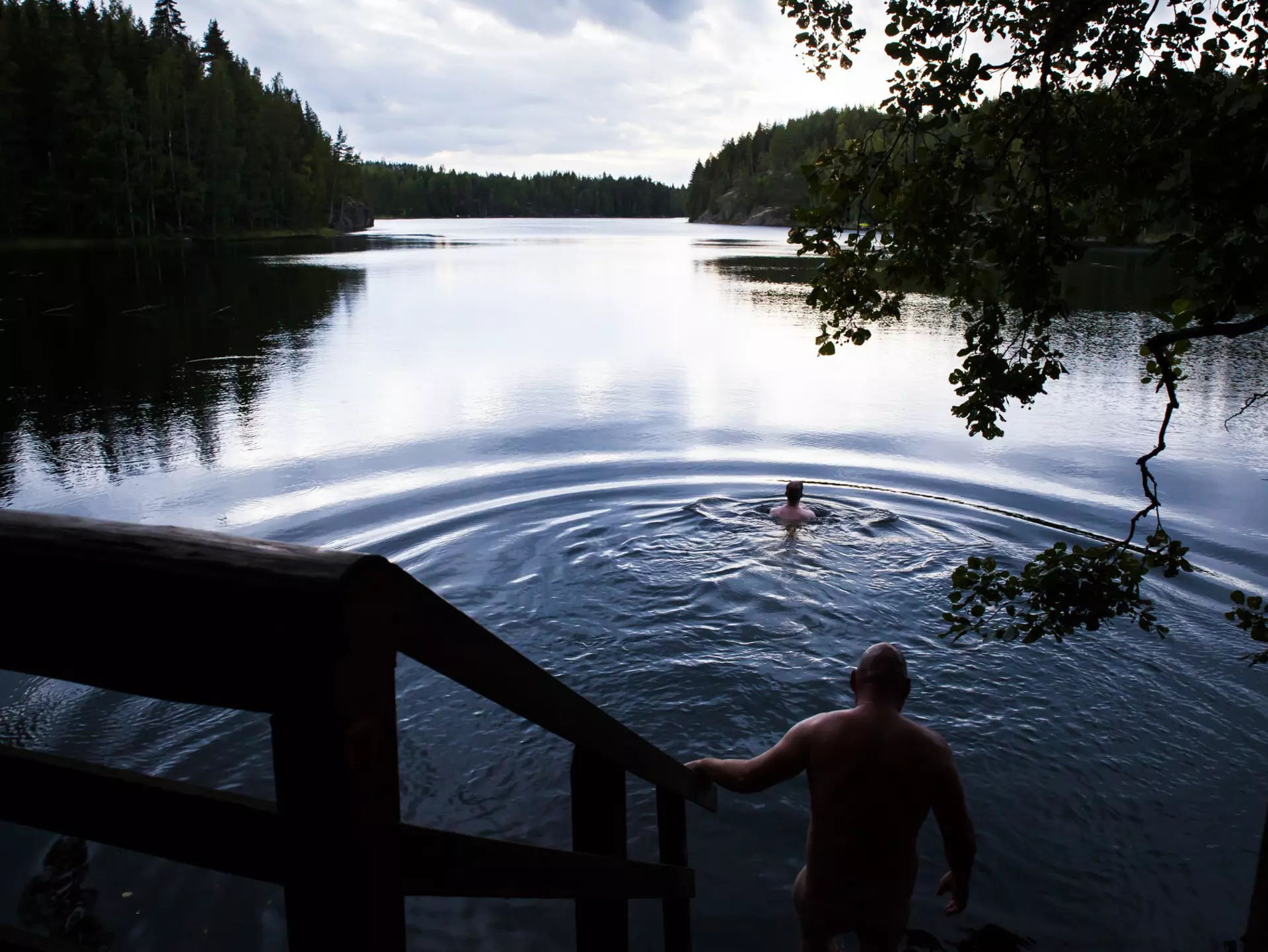 Bathing in Lake Saimaa after a sauna in Finland