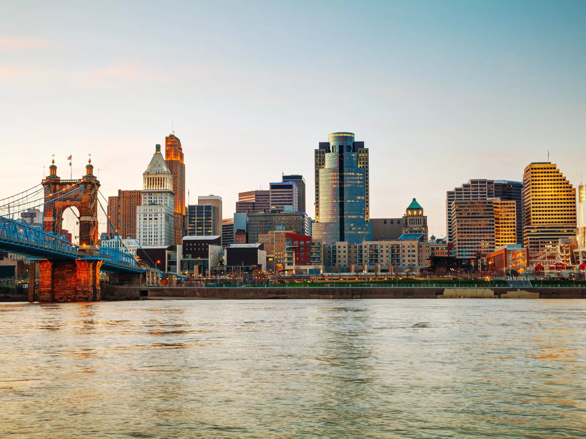 Cincinnati downtown overview early in the night
210935638
downtown, skyscraper, usa, ohio, reflection, architecture, city, cincinnati, travel, illuminated, waterfront, urban, night, skyline, water, office, dusk, twilight, building, cityscape, river, suspension, bridge