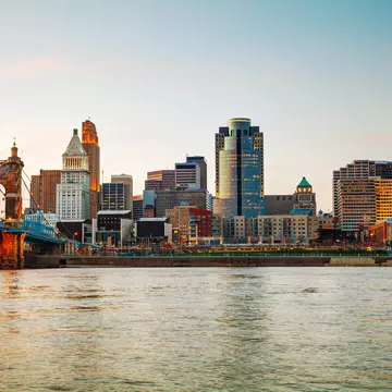 Cincinnati downtown overview early in the night
210935638
downtown, skyscraper, usa, ohio, reflection, architecture, city, cincinnati, travel, illuminated, waterfront, urban, night, skyline, water, office, dusk, twilight, building, cityscape, river, suspension, bridge