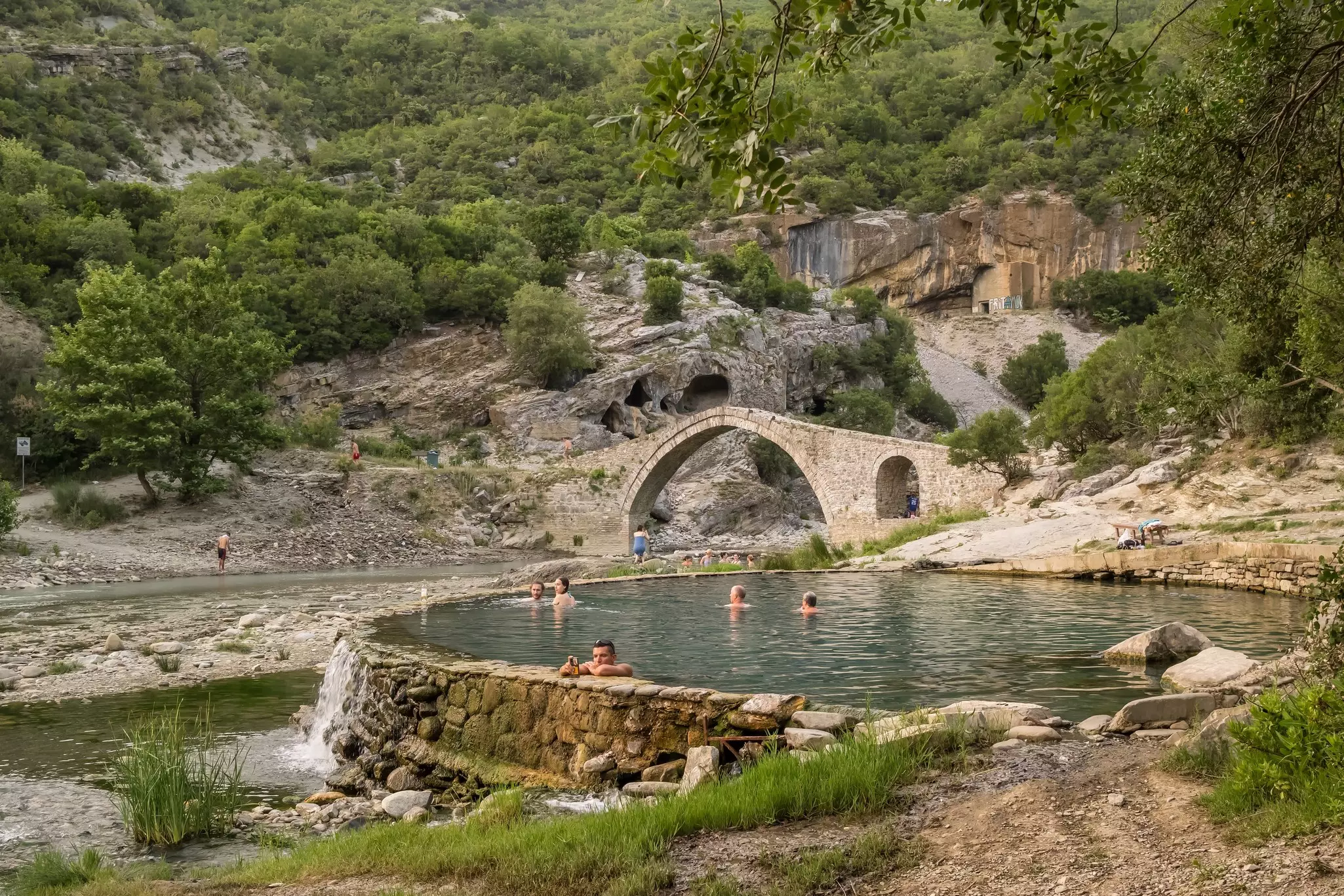 Those not seeking thrills will love a soak in the Bënjë Thermal Baths in Permet, alongside the Vjosa © Mazur Travel / Shutterstock