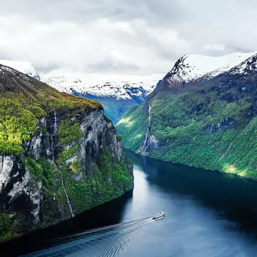 Take in the spectacular scenery on a ferry through Geirangerfjord © Marco Wong / Getty Images