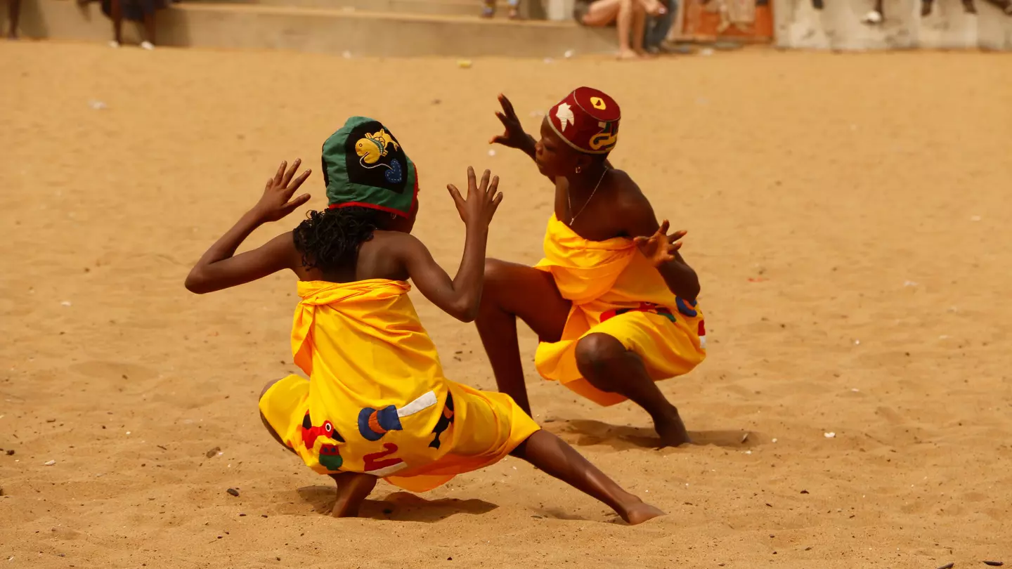 Children dancing on the beach during a Vodou festival in Benin © Cora Unk Photo / Shutterstock